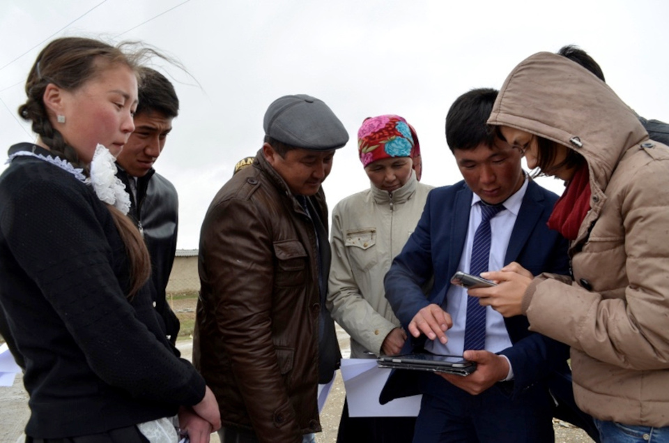 Villagers from Kyrgyzstan mapping with tablet and fieldpapers